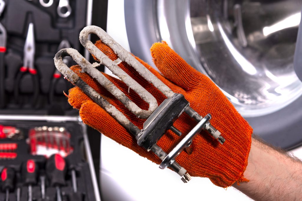 repair-washing-machines-hand-repairman-with-turbulent-electric-heater-covered-with-coating-hard-water-replacing-electric-heater-washing-machine